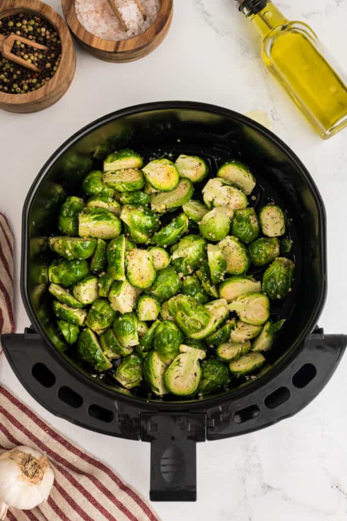 Preheat the air fryer to 385 and spray the air fryer basket with non-stick cooking spray. Add the Brussels sprouts to the air fryer basket and cook for 10 minutes. After 5 minutes, shake the Brussels sprouts around in the basket to ensure even cooking and cook for the remaining 5 minutes. 
