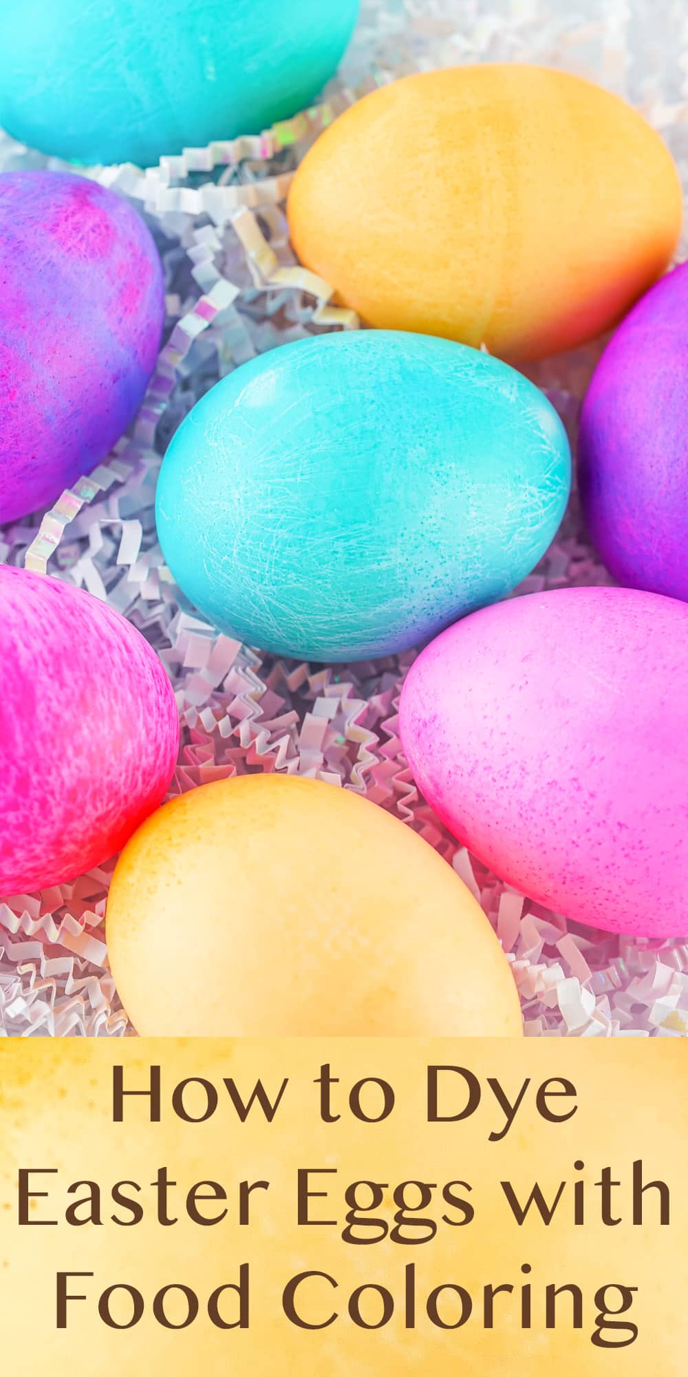 Easter eggs on white Easter grass, title How to Dye Easter Eggs with Food Coloring underneath.
