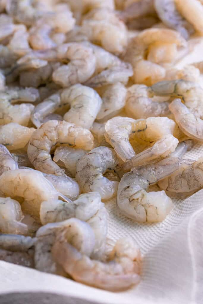 Heat peanut oil in a deep fryer or Dutch oven to 350F. Dry the shrimp with paper towels.