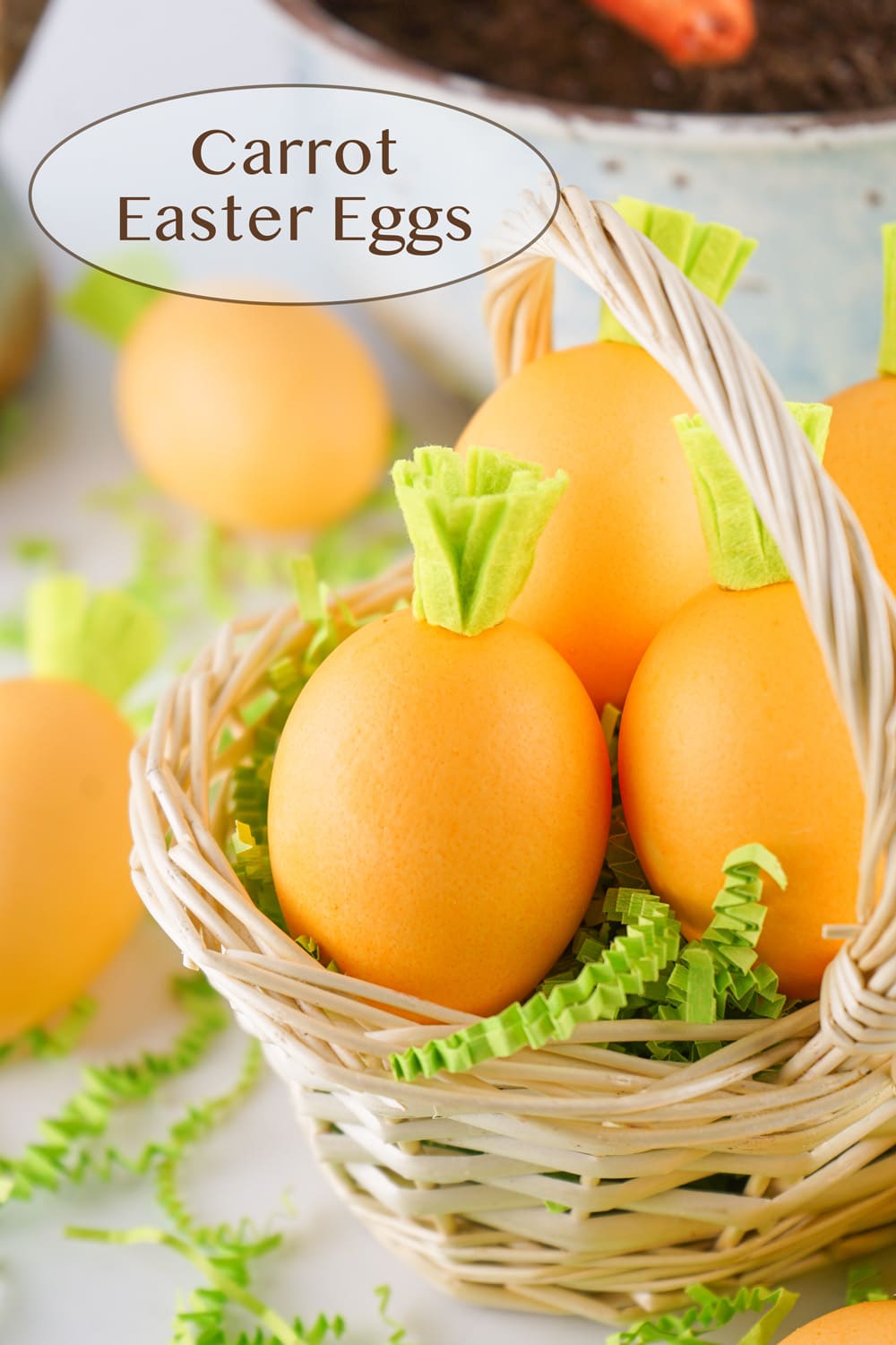 Easter Eggs with little green felt tops to look like carrots in an Easter basket.