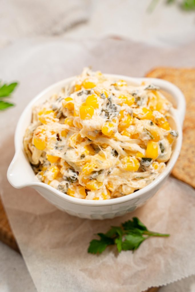 A small bowl with the corn dip in it.