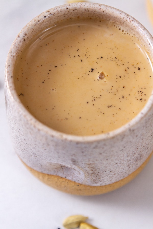 close up on a mug filled with chai tea.